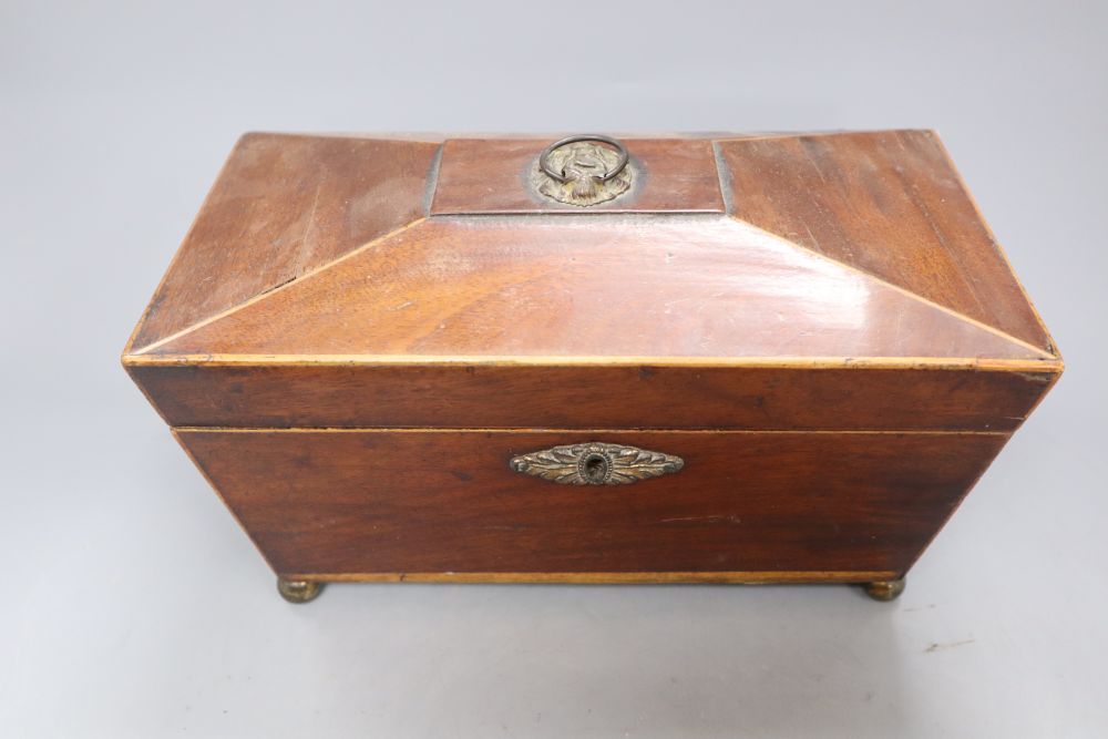 A Georgian mahogany tea caddy with associated mixing bowl and a similar writing slope, longest 35.5cm